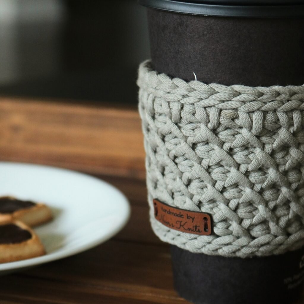Looking for an easy free crochet cup holder pattern? Check out this fun Tunisian crochet cup holder and crochet mug holder pattern!