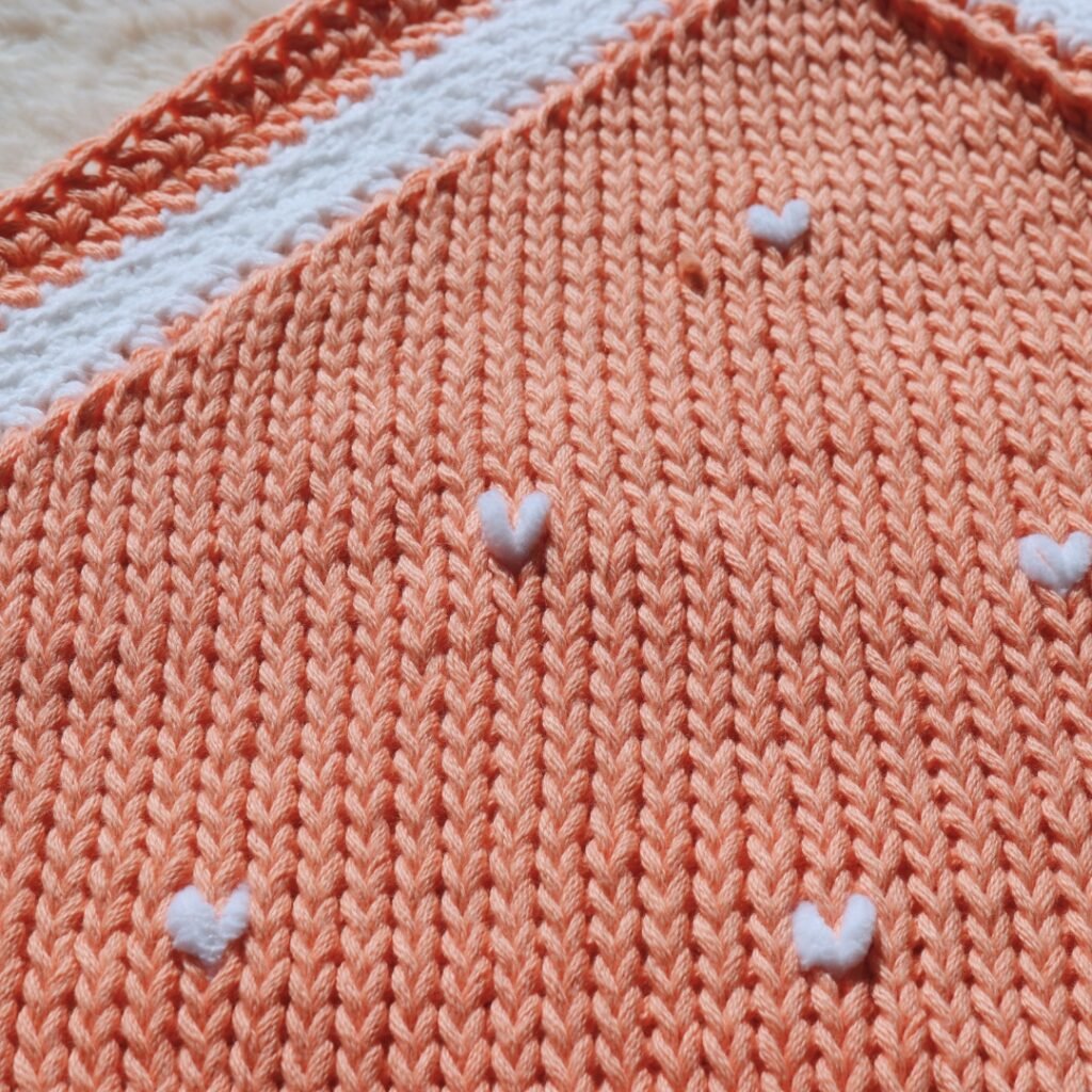 Check out this newborn crochet blanket, a perfect knit like crochet baby blanket to practice the basic Tunisian crochet stitches.