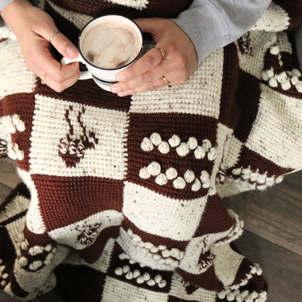 Free crochet afghan patterns featuring the cozy cocoa lapghan with Tunisian crochet stitches and crochet colorwork.