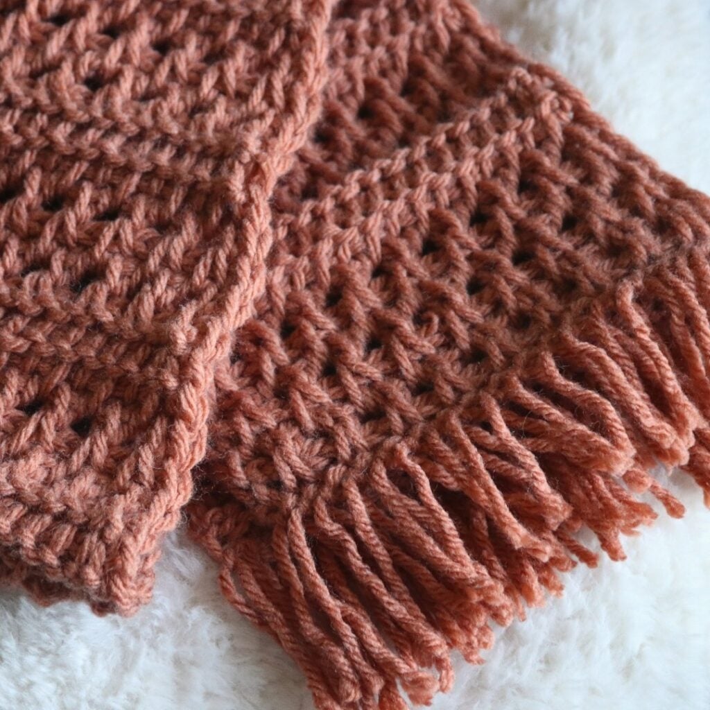 Free crochet scarf pattern using basic Tunisian crochet stitches that creates a beautiful texture for a chunky crochet scarf pattern.
